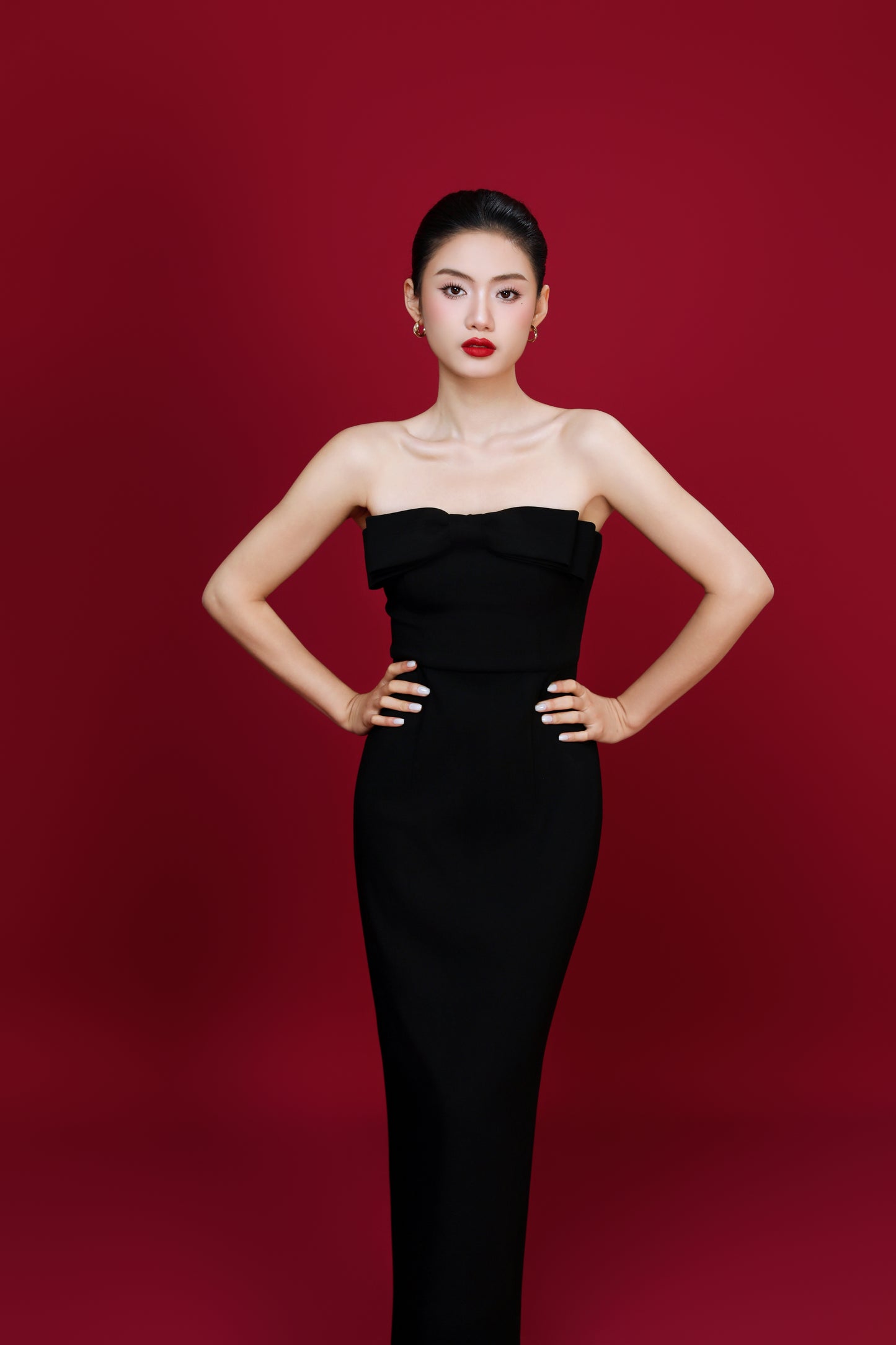 Model showcasing Amelia dress movement in an indoor lighting
