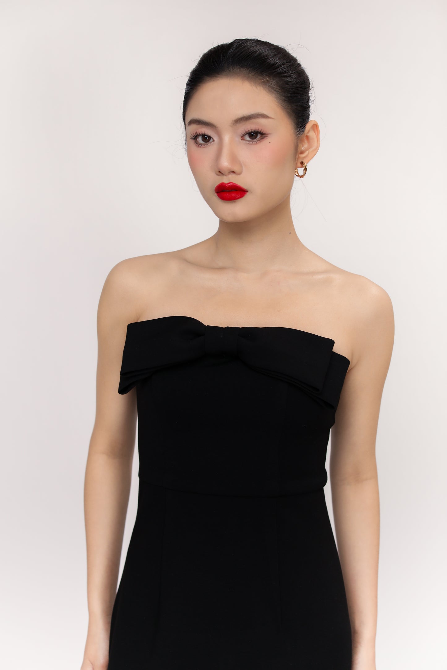 Close-up of Amelia dress bodice with elegant bow detail
