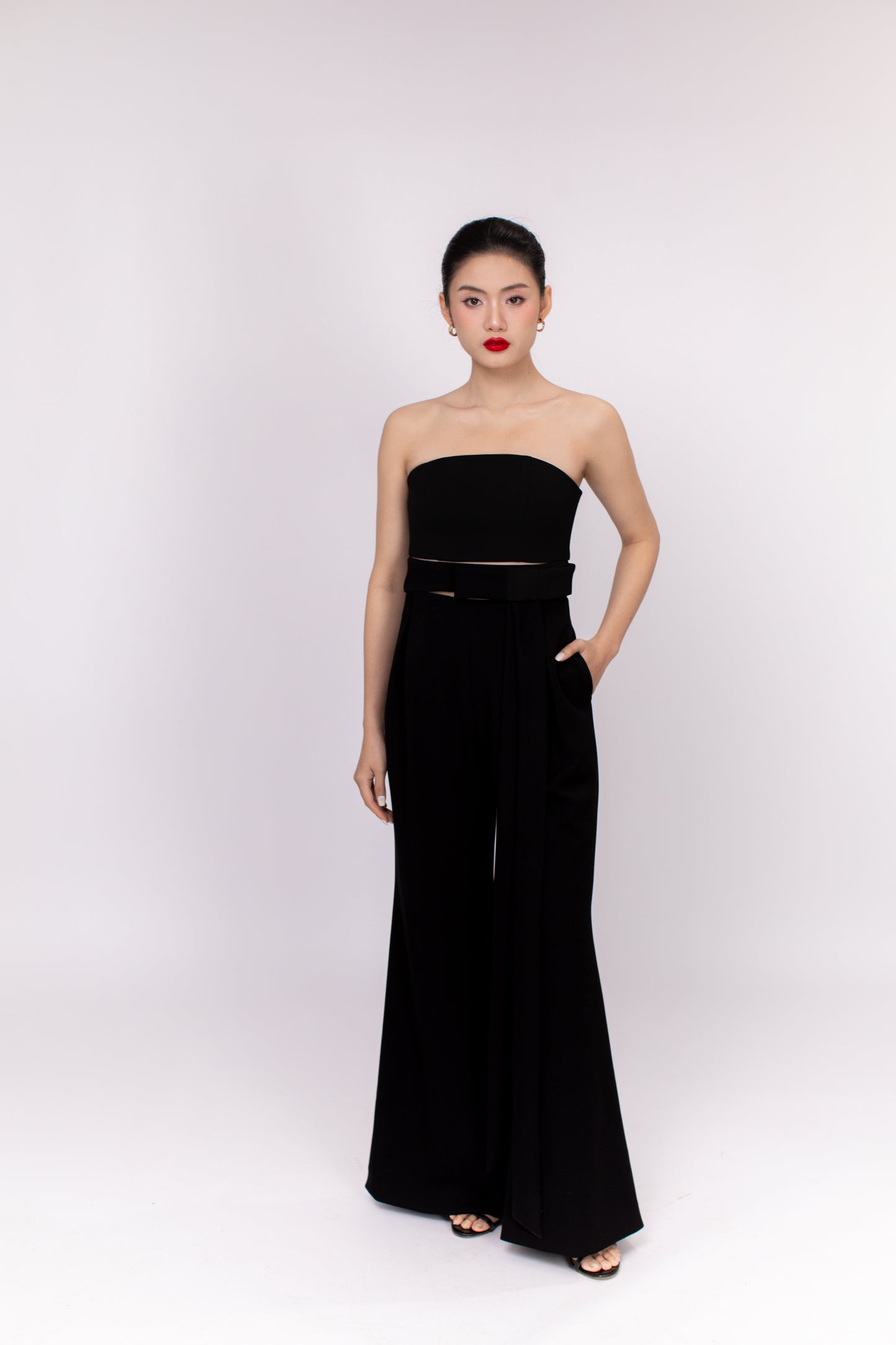 Brooklyn jumpsuit paired with minimalist accessories for a versatile day-to-night outfit