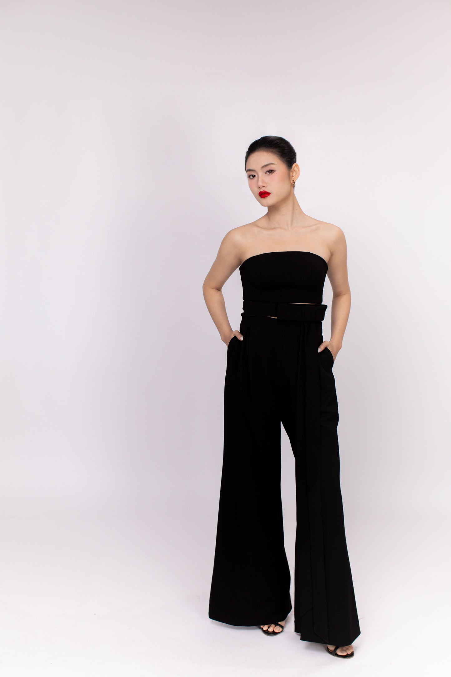 Model posing in Brooklyn jumpsuit highlighting flow and movement