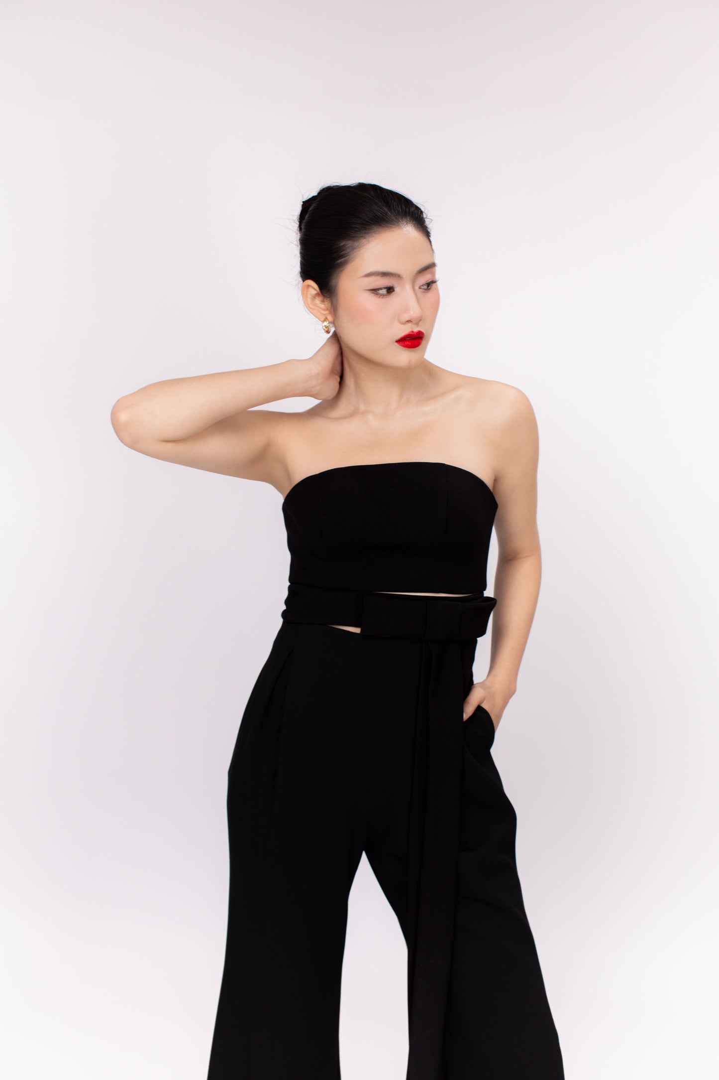 Model wearing Brooklyn minimalist jumpsuit showing relaxed tailored fit