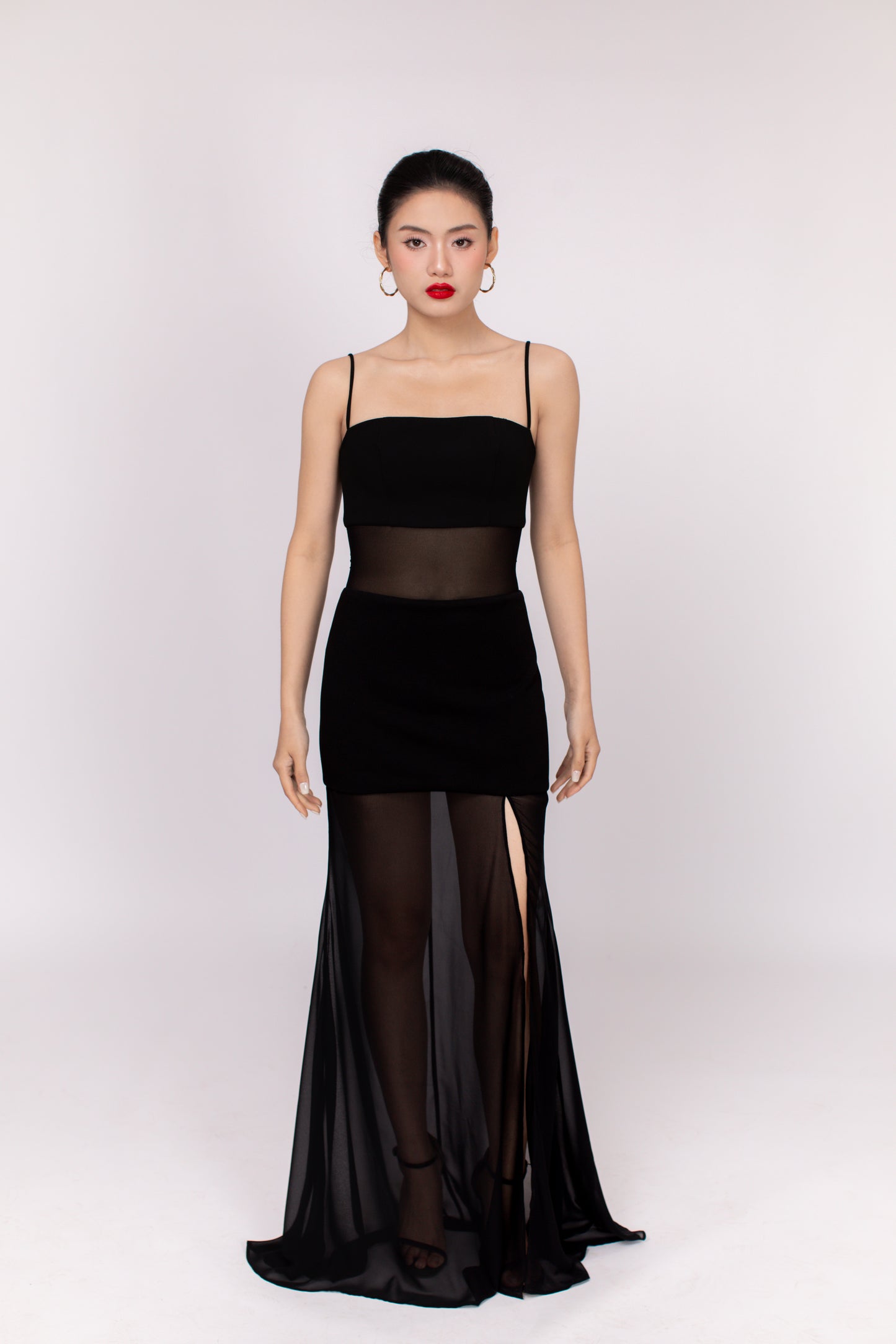 Detail shot of Dahlia dress side slit and soft fabric folds