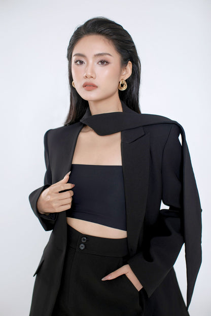 Model wearing the black Ellen blazer over a black top