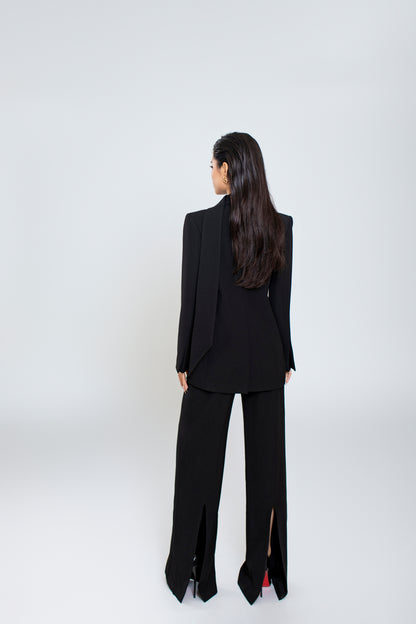 Back view of Ellen blazer with clean lines and minimalist design, pair with black Freya trousers with seamless finish and back slit


