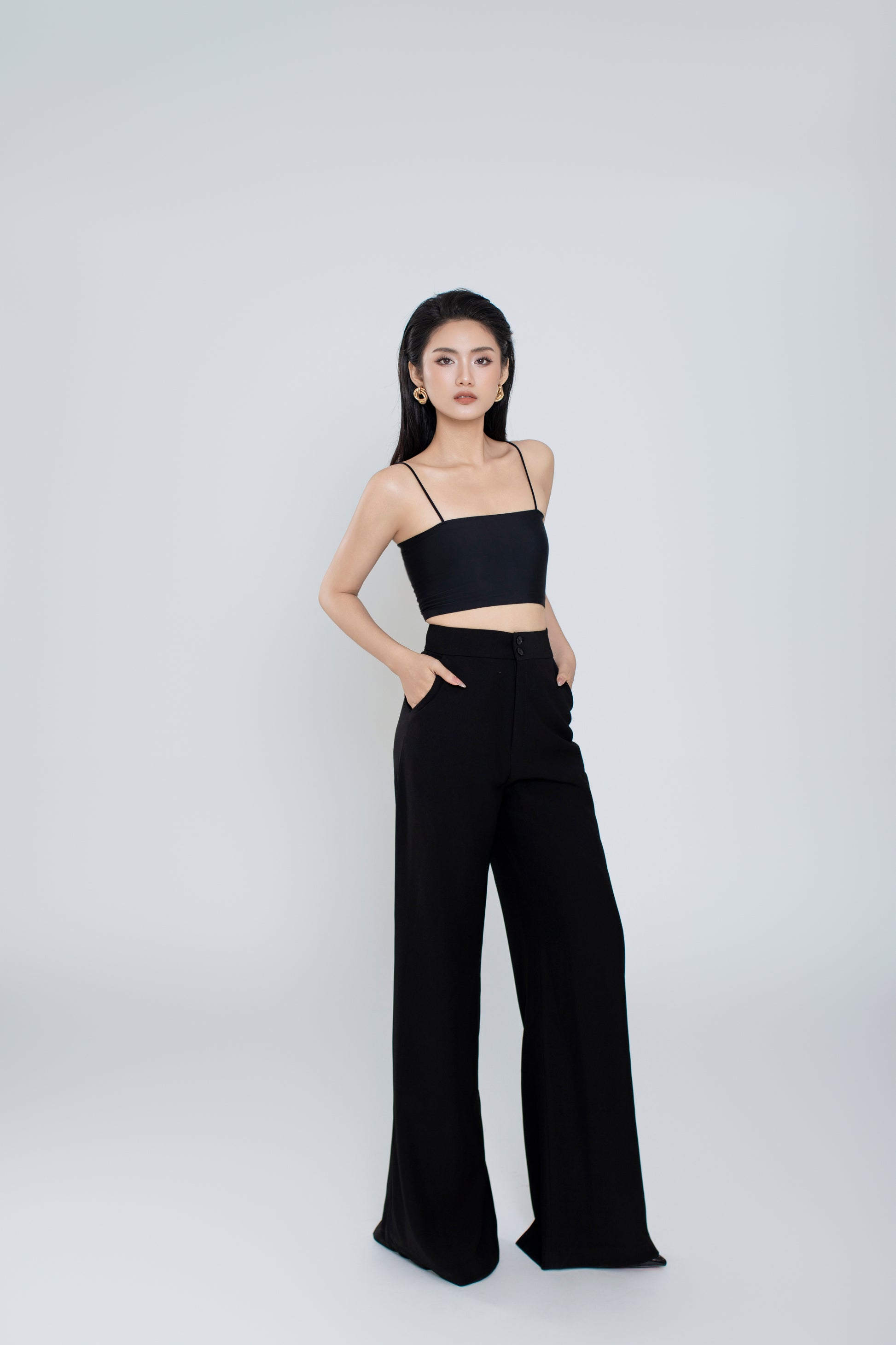 Side profile of Freya pants showing relaxed wide-leg silhouette
