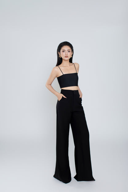 Side profile of Freya pants showing relaxed wide-leg silhouette