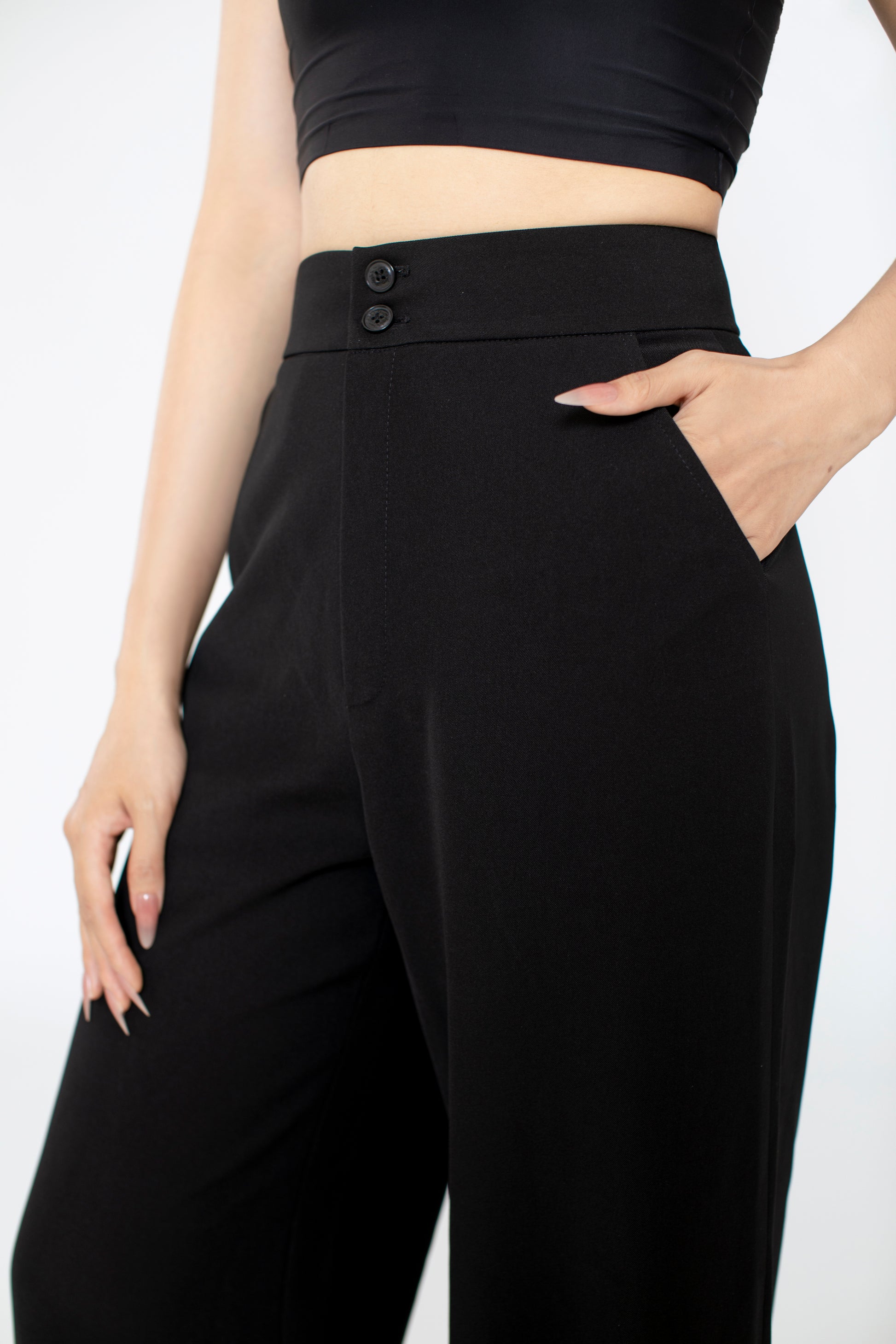 Close-up of Freya pants fabric texture and premium stitching, with thick waist band and side pocket