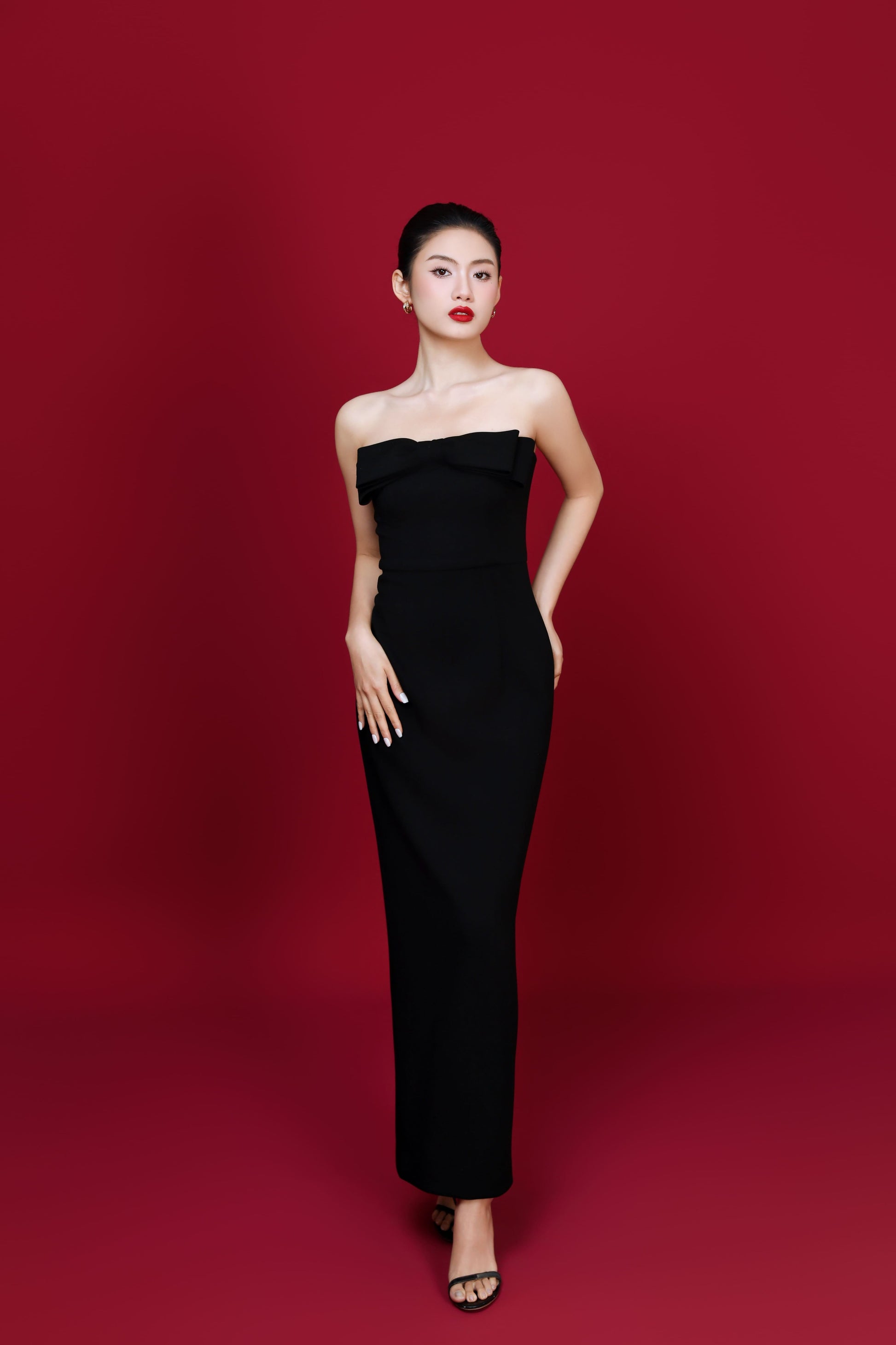 Front view of Amelia dress in black with structured strapless bodice

