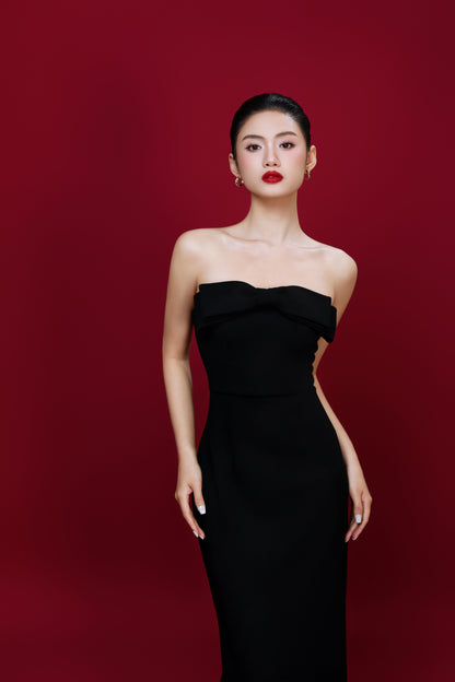 Model wearing Amelia off-white dress styled for elegant daytime event