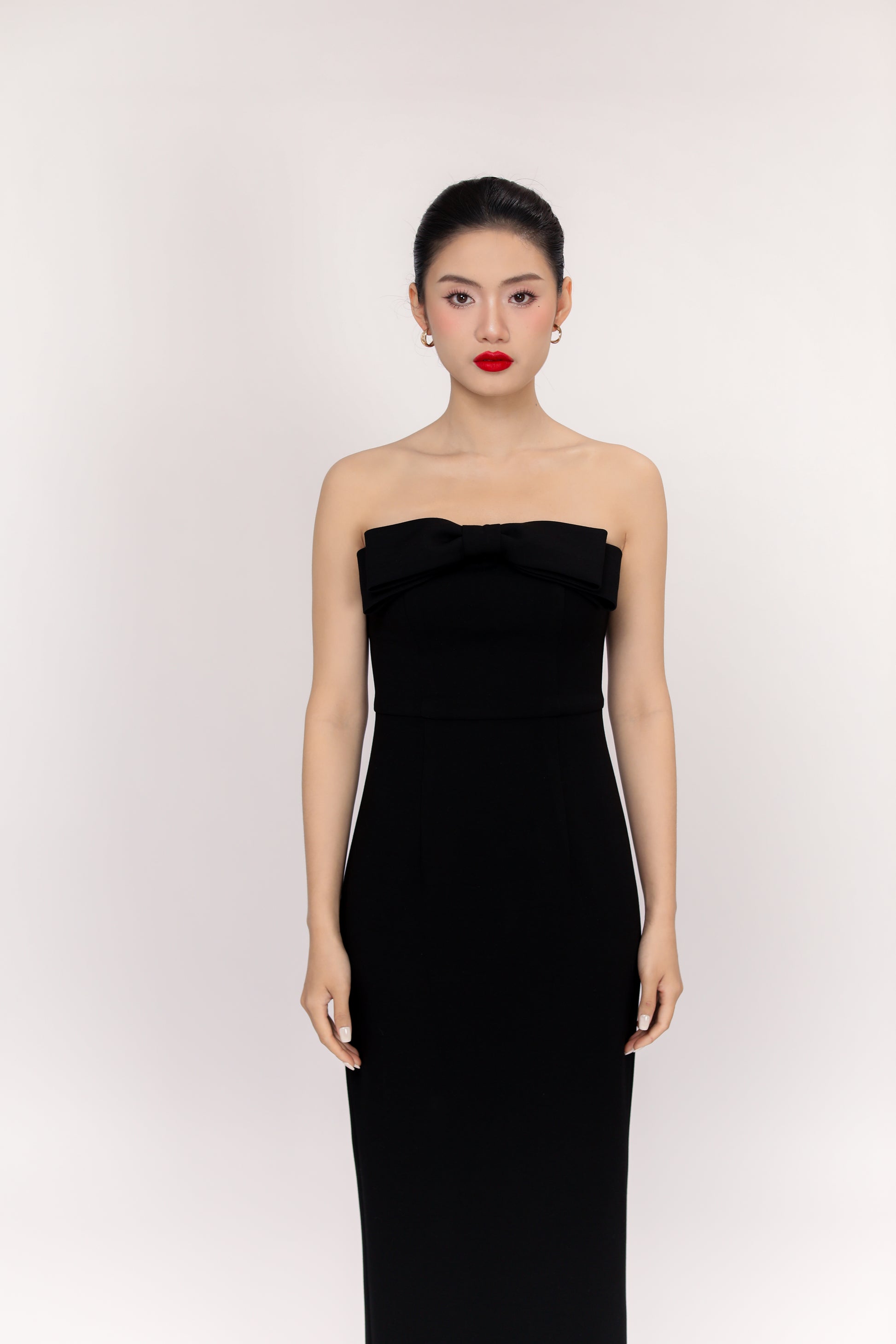 Amelia dress paired with minimal earrings for a refined party guest look