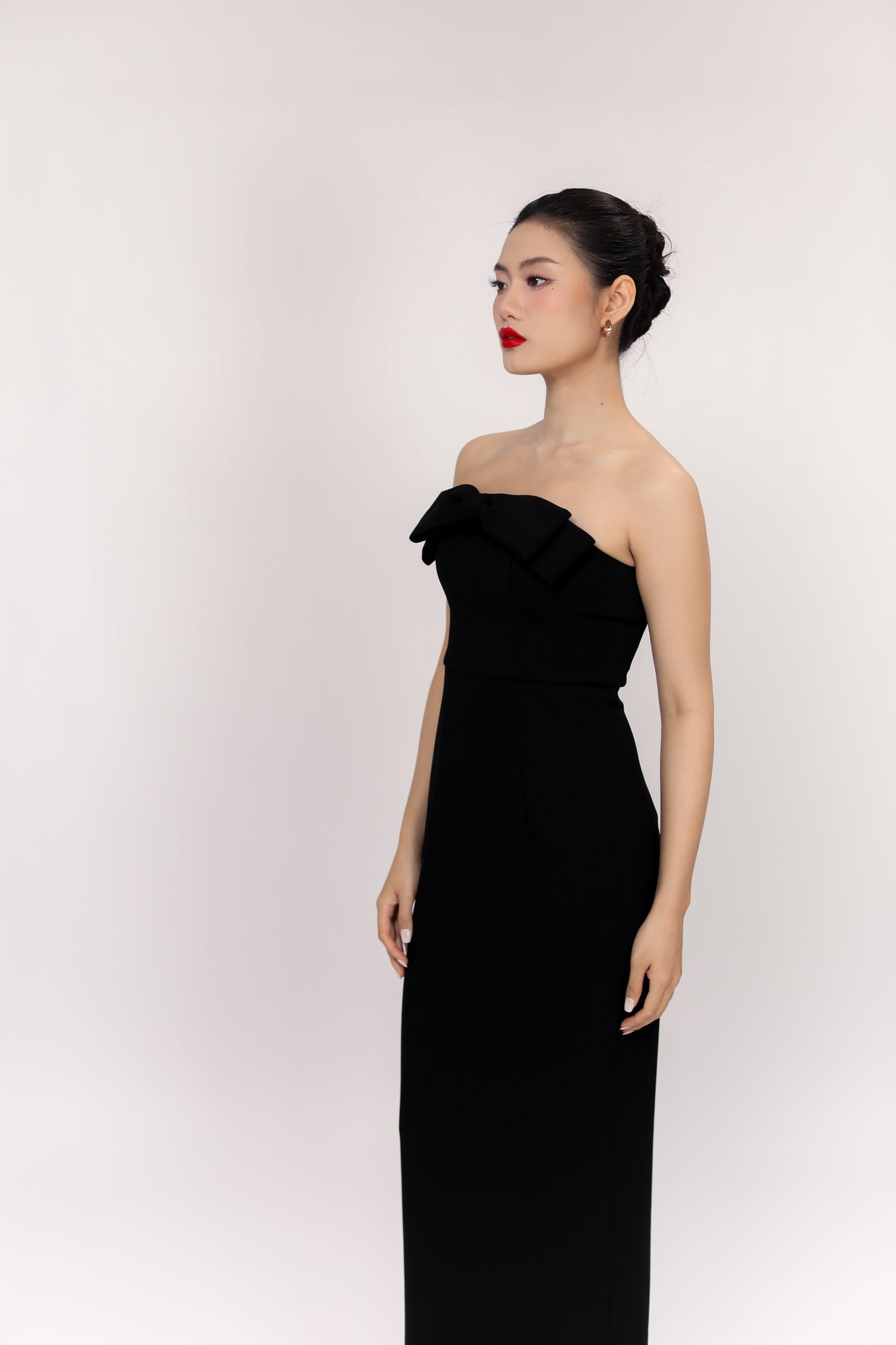 Side profile of Amelia sleeveless maxi dress showing flattering fitted silhouette