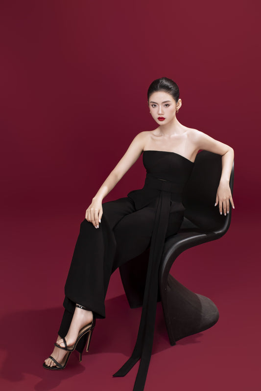 Model wearing Brooklyn black jumpsuit styled with heels for an elegant look
