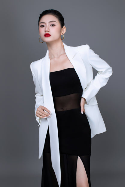 Model wearing Ellen blazer styled with Dahlia black dress for a chic, versatitle look