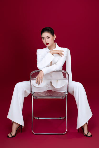 Model wearing Freya beige pants styled with minimalist white Ellen blazer