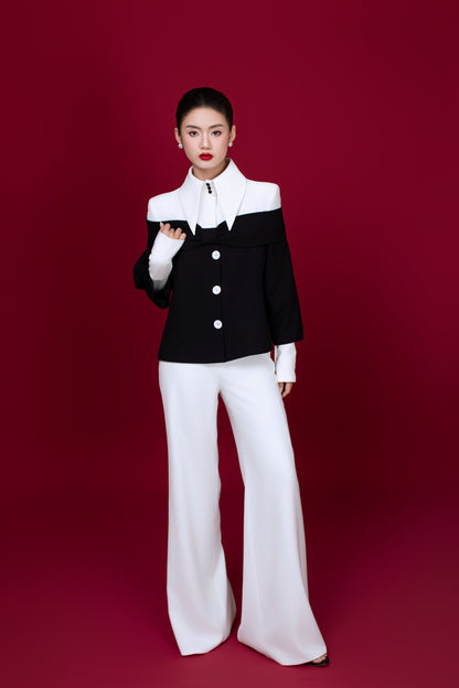 Model wearing Grace two toned top styled with monochrome elegant outfit