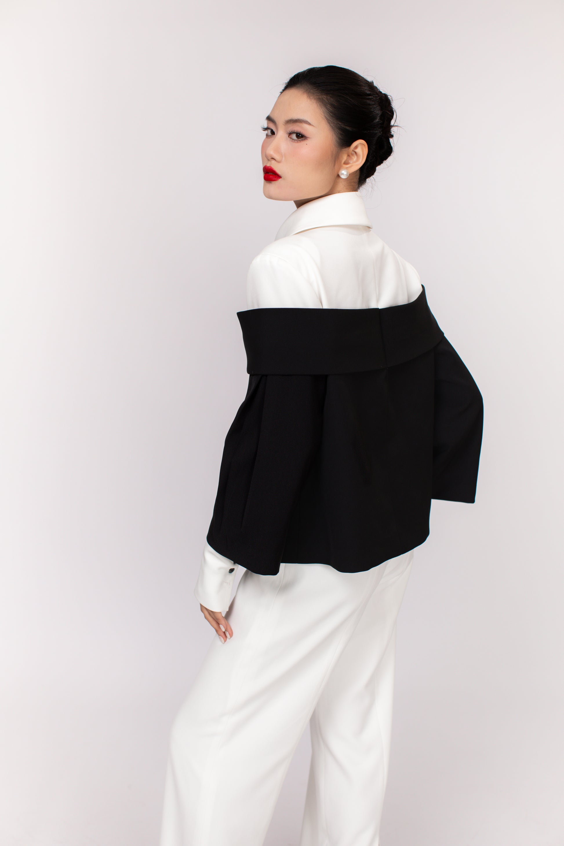 Model showcasing back view of Grace top showing smooth silhouette and lightweight fabric