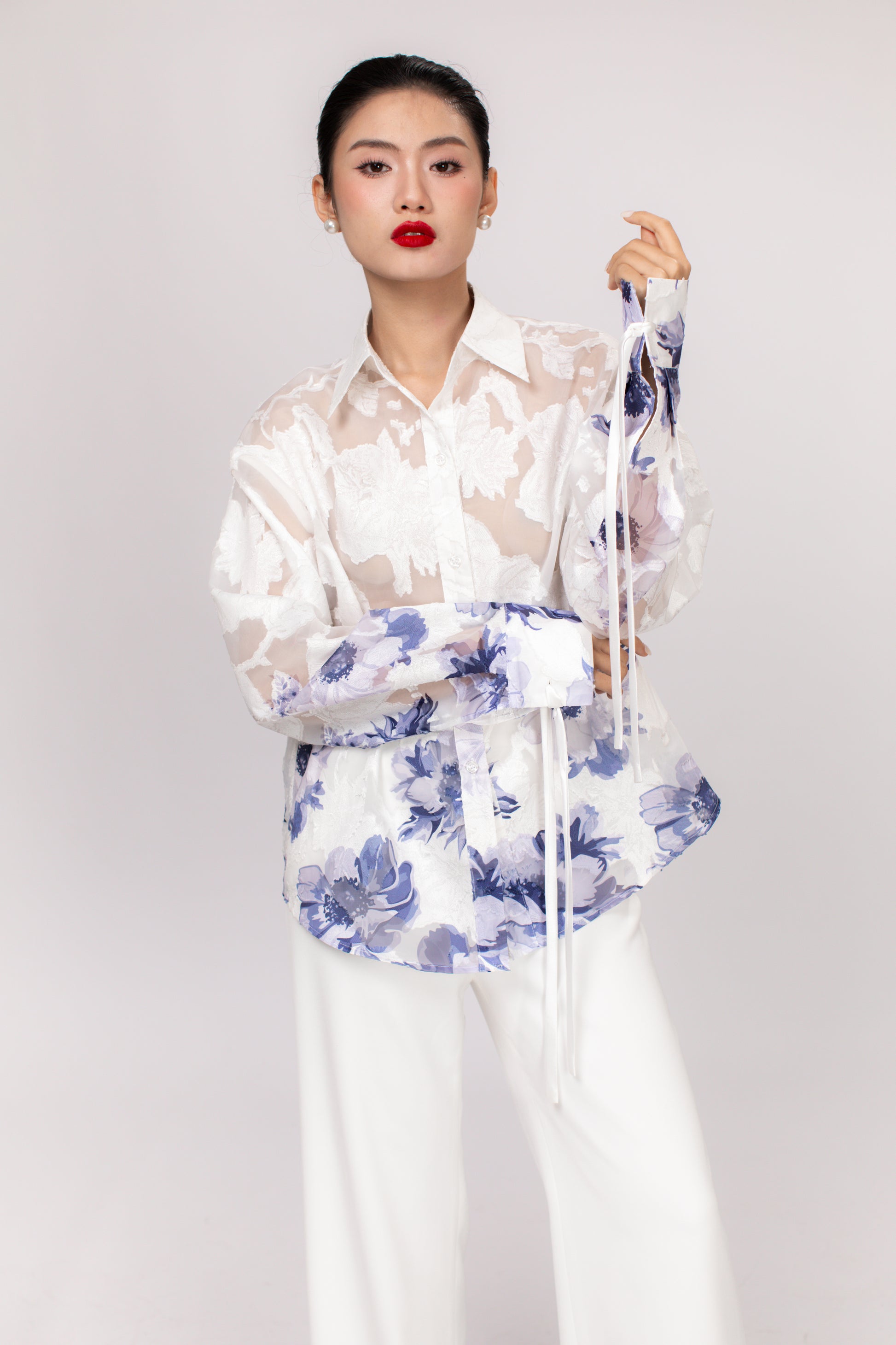 Detail of Hallie top sleeve and hemline showing high-quality stitching