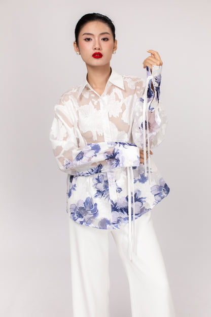 Detail of Hallie top sleeve and hemline showing high-quality stitching